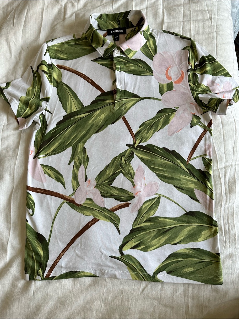 Express White Polo with Green Tropical Leaf and Soft Pink Blossoms